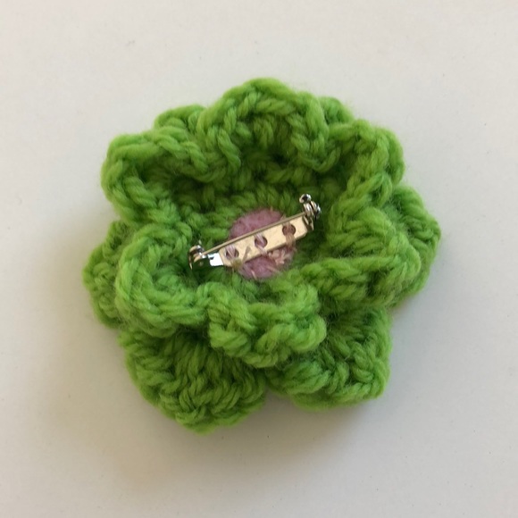 Crochet flower pin adds a bit of fun to your winter wardrobe - Picture 2 of 3